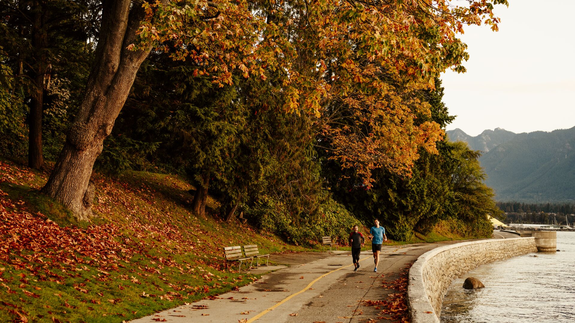 Joggers out for a run along the Stanley Park Seawall